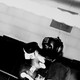 Two boxers in headgear and gloves face off