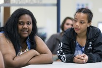 One student talks and another looks at her