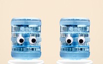 Two water coolers looking at each other awkwardly