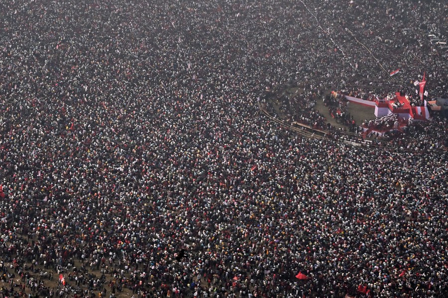 An aerial view of a large crowd at a political rally