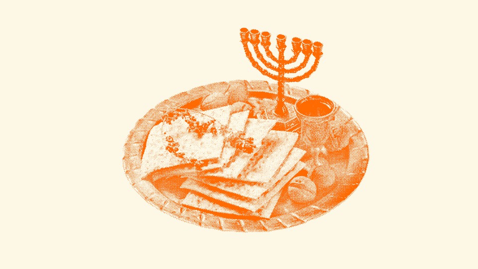 A plate with matzah, wine, and a menorah