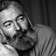 A black and white portrait of Ernest Hemingway