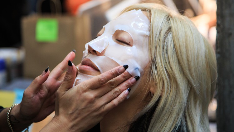 A model wears a face mask