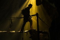 Indiana Jones, shown in silhouette