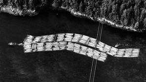 Tug boats move rafts of timber along the coast of Vancouver Island in Nanaimo, British Columbia, Canada, on Monday, May 10, 2021.
