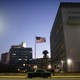 A car drives past the U.S. Embassy in Havana