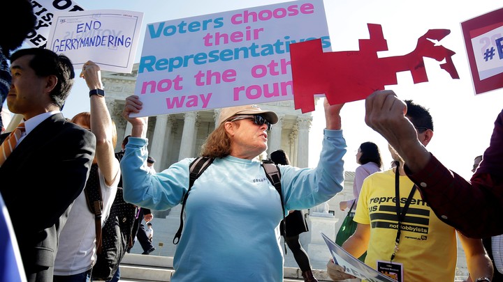 Demonstrators rally at the Supreme Court.