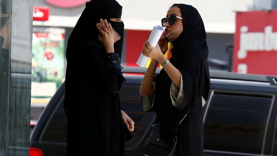 Saudi women speak on their phones in Riyadh.
