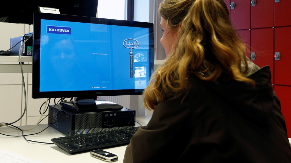 A student sits at a computer.