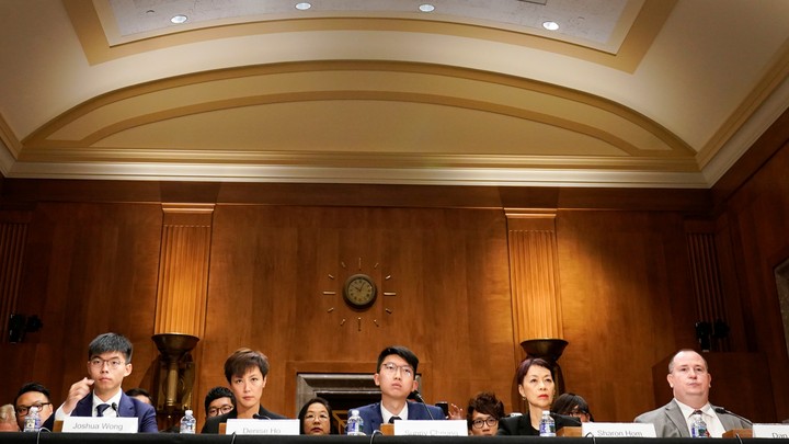 The Hong Kong pro-democracy campaigners Joshua Wong (far left) and Denise Ho (left) testify in Congress.