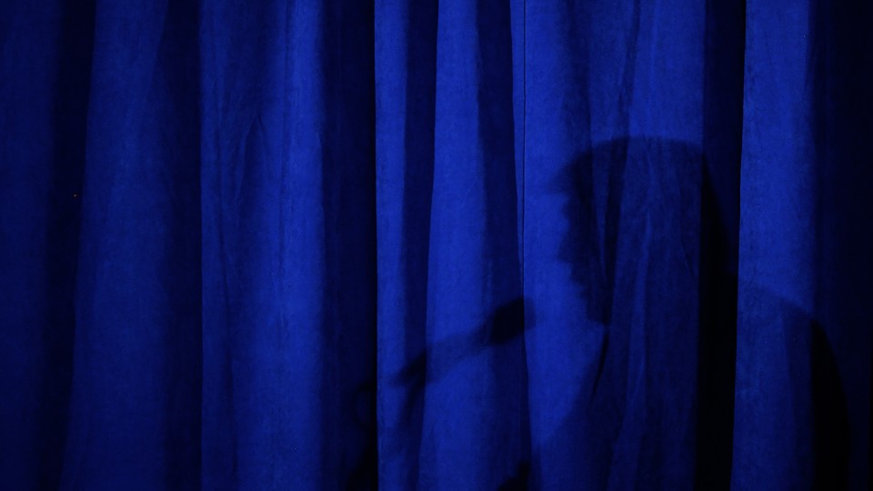 Reflection of Trump in blue curtain