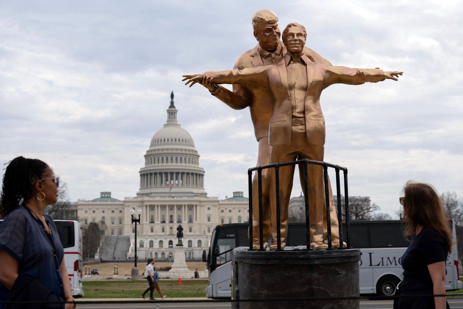 An odd-looking golden statue, depicting Donald Trump and Jeffery Epstein posing like Jack and Rose on the bow of the Titanic.