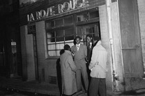 Paris, France: Four Black men stand outside La Rose Rouge, December 4, 1948.