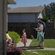 A family in a suburban neighborhood