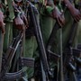 Kenyan soldiers holding guns.