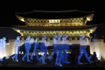 Holograms of protesters are shown in front of Gyeongbok Palace in South Korea