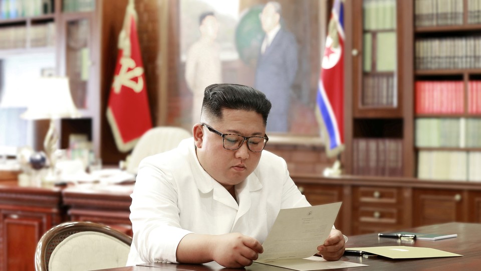 North Korean leader Kim Jong Un reads a letter from American President Donald Trump.