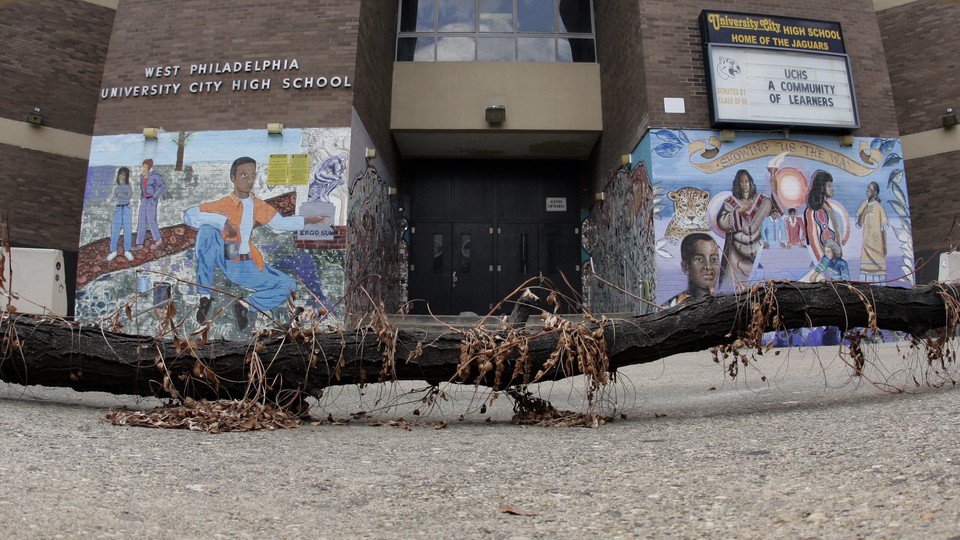 A broken tile mural that reads "We Ought to Protect Our Neighbors And"