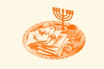 A plate with matzah, wine, and a menorah