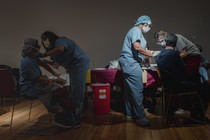 Staff at Temple University Hos​pital receive the coronavirus ​vaccine in Philadelphia, Dec. ​16, 2020.