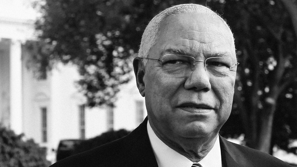 Colin Powell looks past the camera outside the White House.