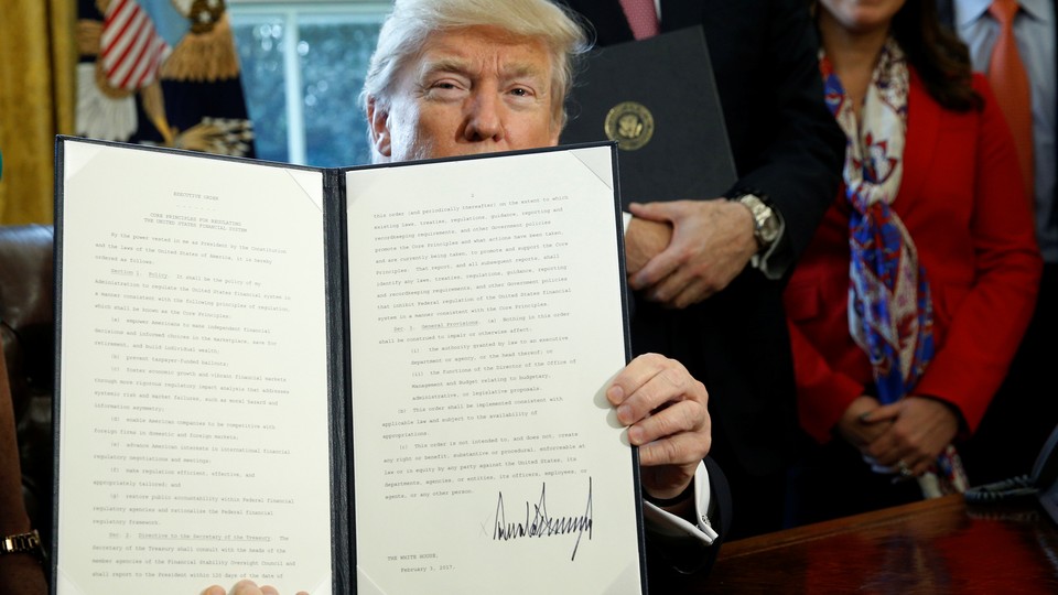 President Trump holds an executive order related to financial regulation.