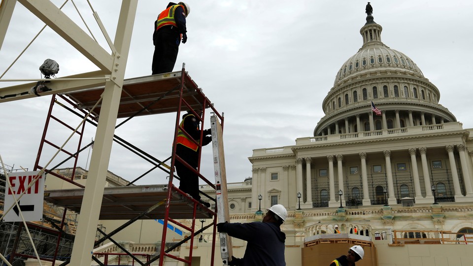 Construction workers in front of the U.S. Capitol