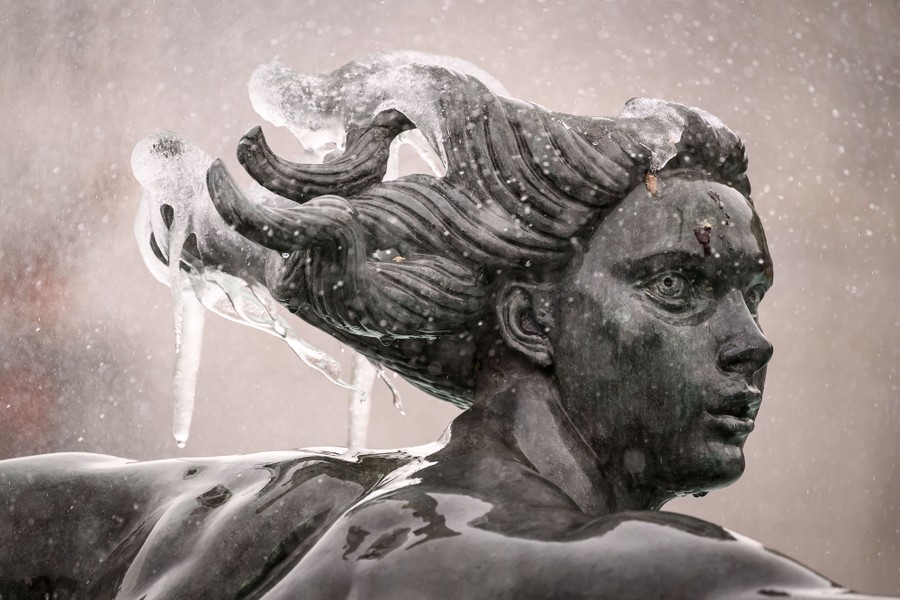 Icicles hang from the hair of a mermaid sculpture