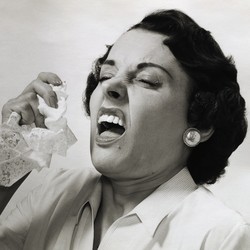 A woman about to sneeze