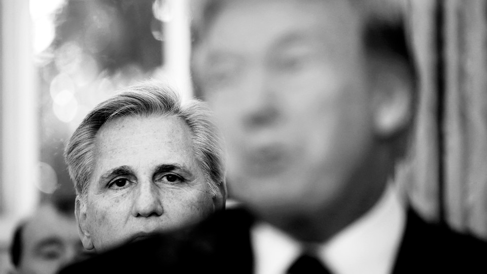 Kevin McCarthy staring at Donald Trump from behind