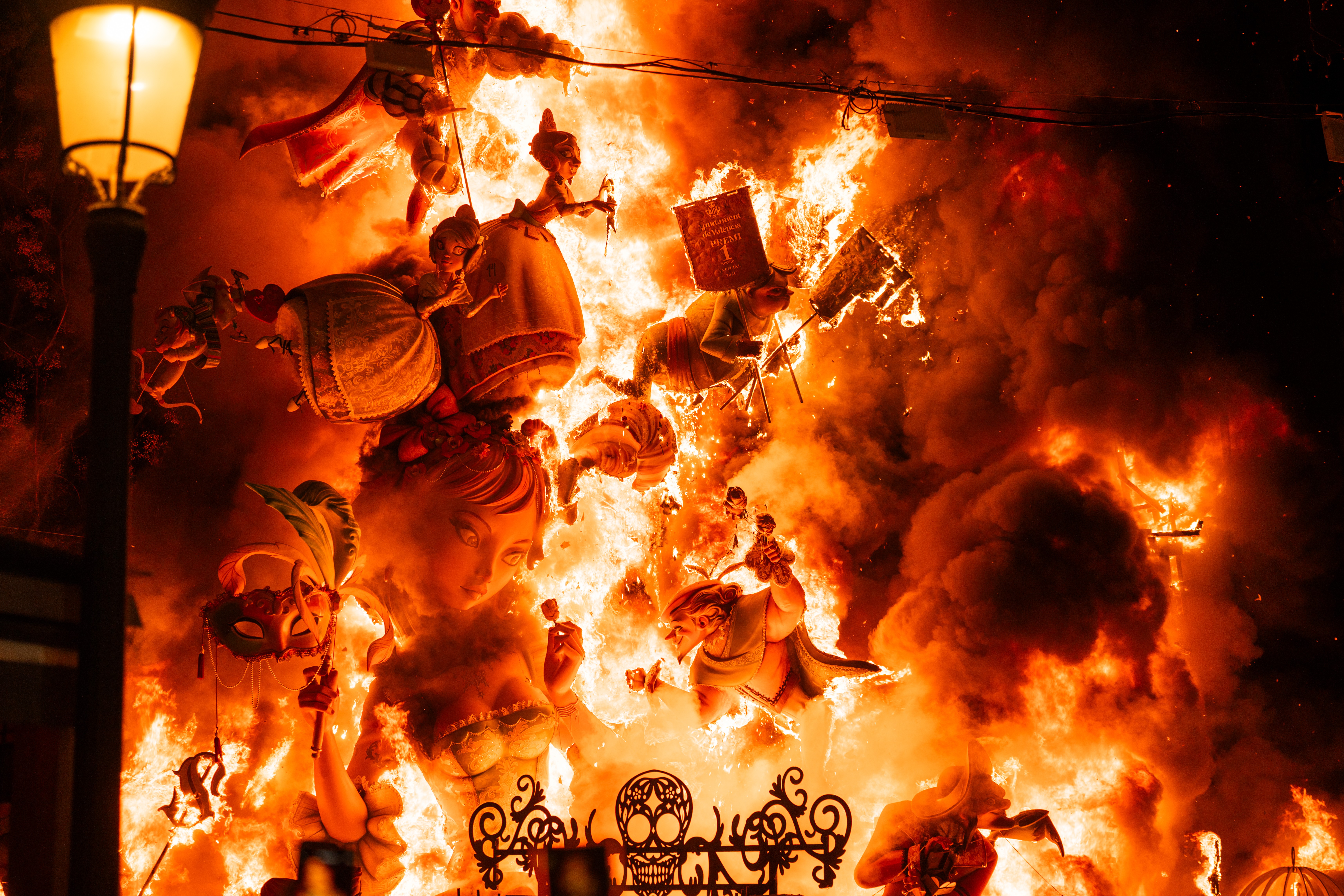 A fantastical sculpture of fairytale figures goes up in flames.