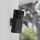 An Amazon Ring camera mounted on an outdoor wall