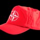 A red baseball cap with the NATO insignia on the front