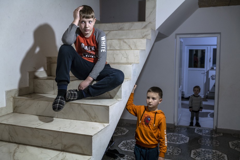 boys on stairs look at camera 