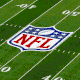 Temu logos covering an NFL football field