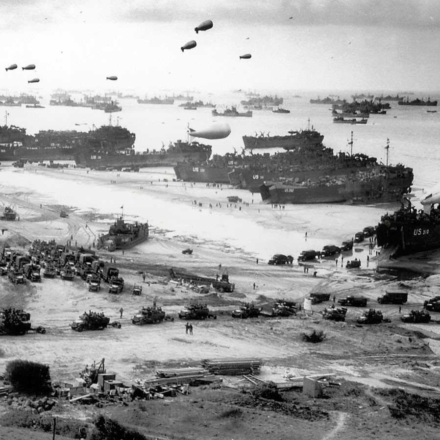 American military vehicles of all styles land at Omaha Beach, Normandy, in 1944
