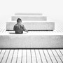 A boy sits on a bench