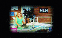 In an animated gif, a television screen featuring an HLN set suddenly goes dark