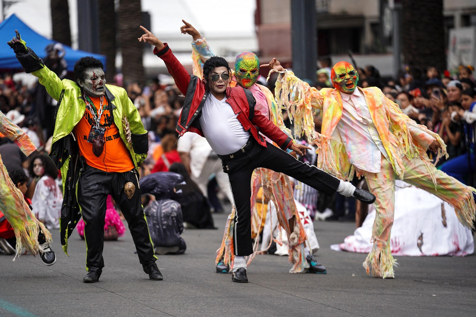 Several costumed people perform a dance number to a Michael Jackson song during a 