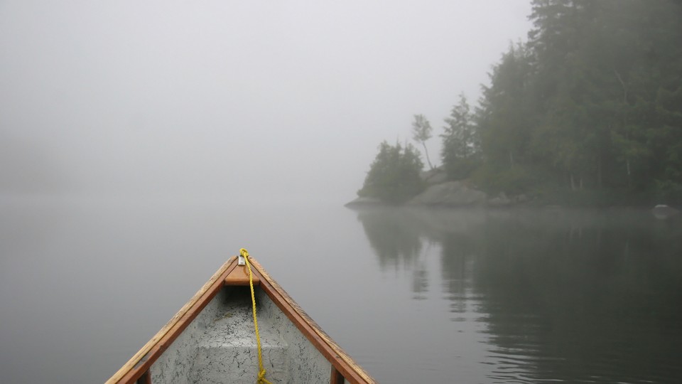 A canoe on foggy Lake Ontario