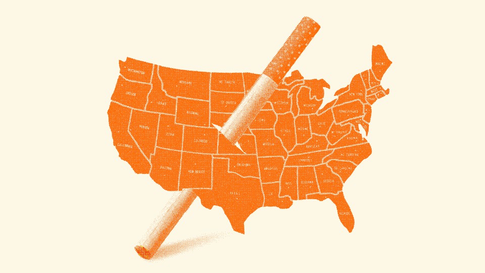 A cigarette hole is cut in the middle of a map of the United States.
