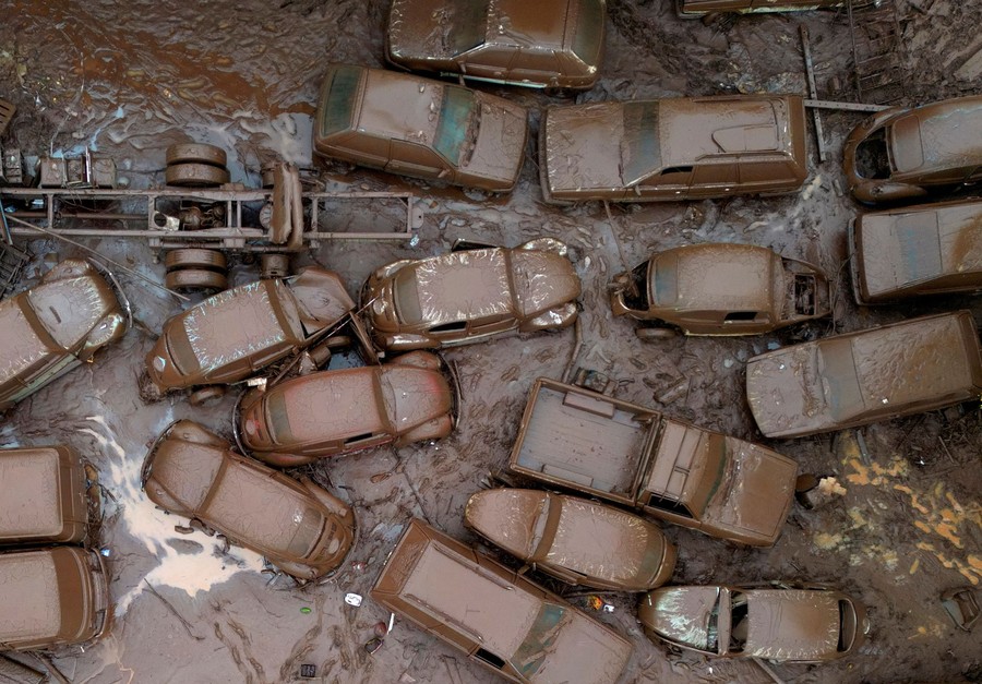 A collection of many mud-covered vehicles