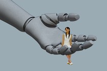 A woman sits on a giant robotic hand