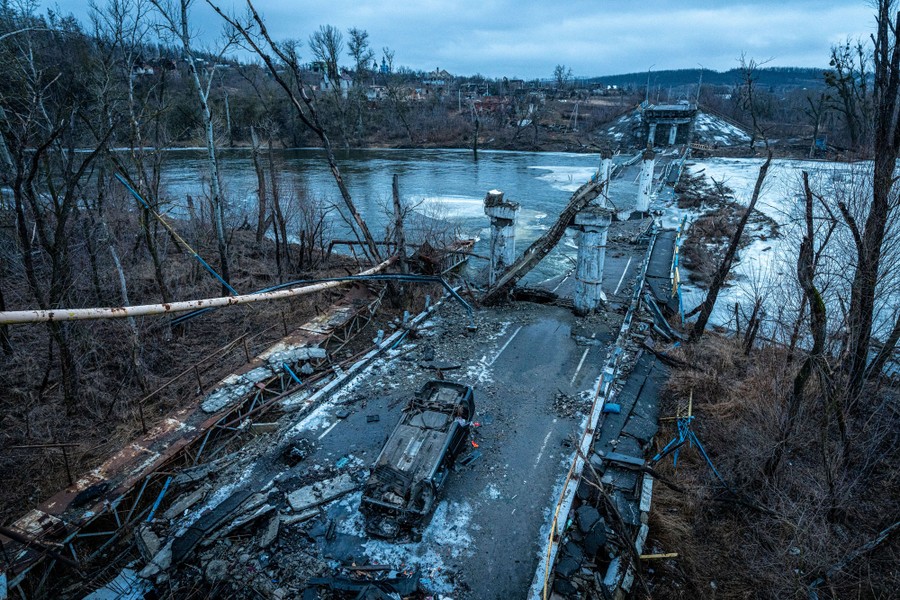 An elevated view of a road bridge that has been destroyed and collapsed