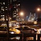 Cars driving at night in front of the Queensboro Bridge