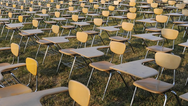 Empty desks fill the frame.