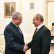 Netanyahu and Putin shake hands at a meeting at the Kremlin in July.