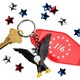 A keychain with a tag reading '1/6' and a miniature bald eagle.