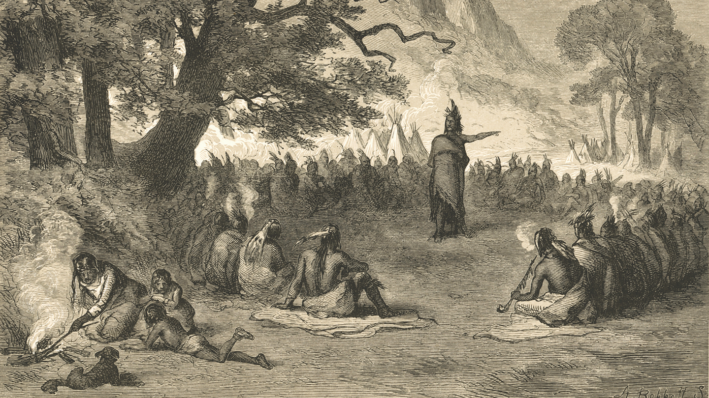 historical black-ink engraving of tribe assembled in seated circle under trees, with member standing in center speaking and gesturing with one arm, teepees in background and woman and children at a fire in foreground