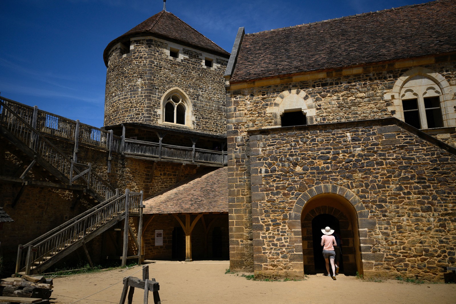 A visitor enters the castle from the courtyard.